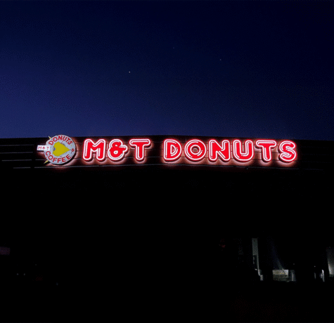 LED channel letter sign glowing on storefront at night by West Coast Sign Shop