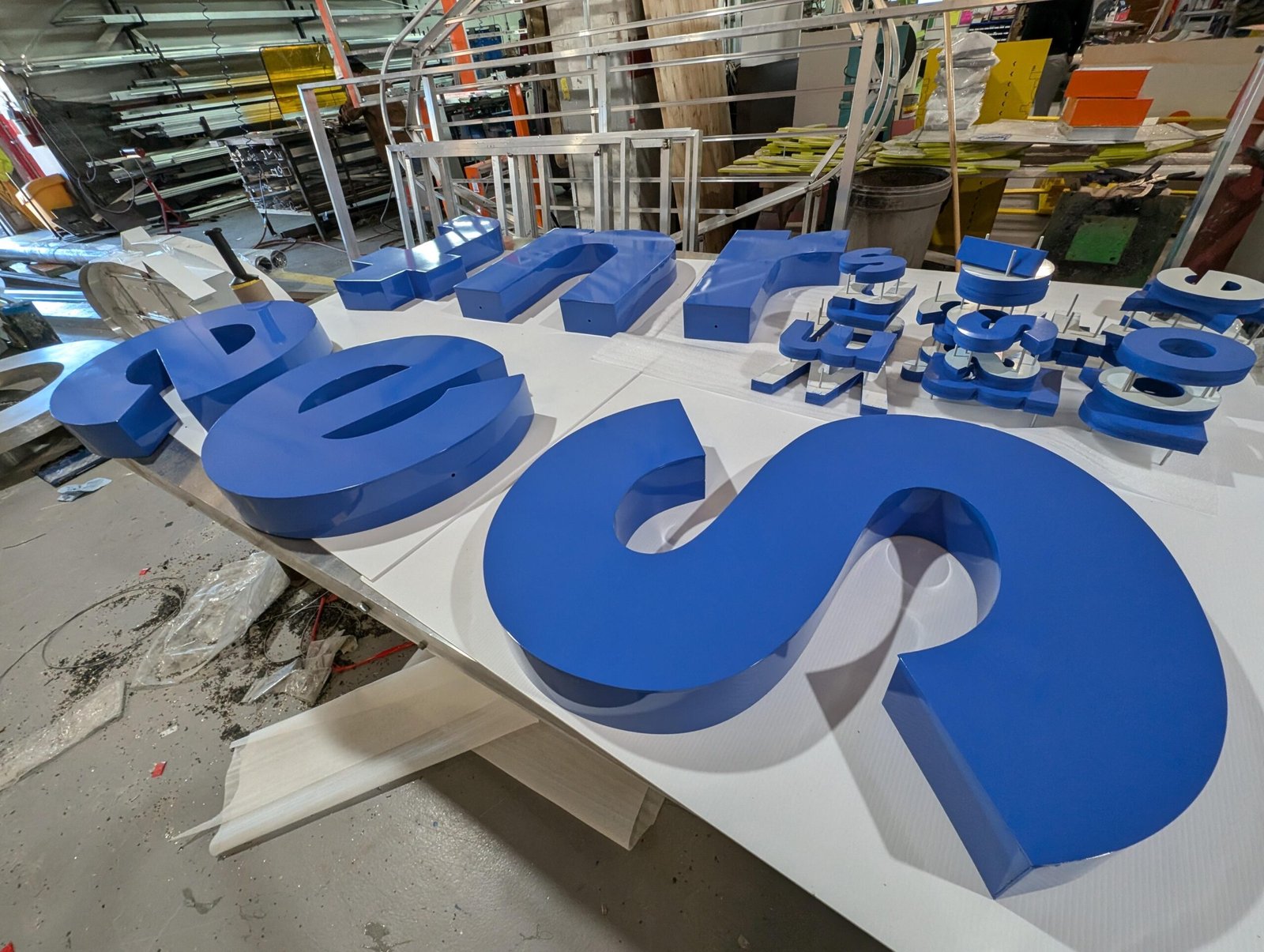 Custom channel letters installed on a commercial storefront | West Coast Sign Shop