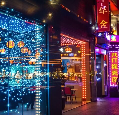 Bright LED lights illuminate a storefront.