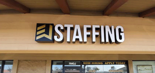 Channel letter sign during installation by West Coast Sign Shop crew