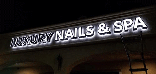 Channel letter signage installed on shopping plaza building